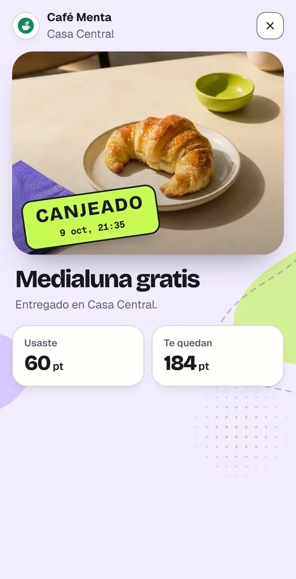 El celular de la clienta con el sello «Canjeado»: la medialuna gratis se entregó en Casa Central de Café Menta, usó 60 puntos y le quedan 184.